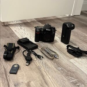 Nikon DSLR D7000 Camera with Black Battery Grip and Accessories